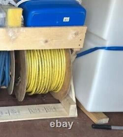Window cleaning water storage tank, water fed pole and 100m hose reel